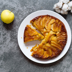 cake with ricotto, apple and pear, on a white table. view from above