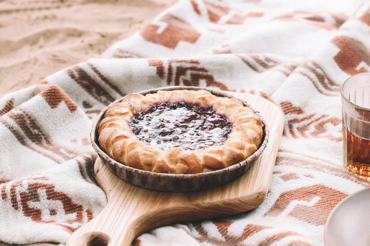 Berry pie and glasses of tea. Picnic concept