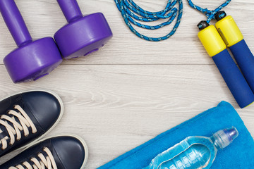 Different tools for fitness on floor in room