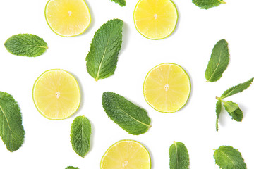 Ripe lime slices and mint leaves pattern isolated on white background, top view