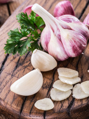 Garlic bulb and garlic cloves  on the wooden table.