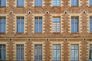 Nantes patterns on a wall and its windows