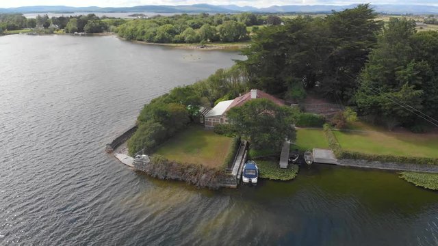 A house on the shores of Lough Corrib near the town of Headford in County Galway, Ireland.