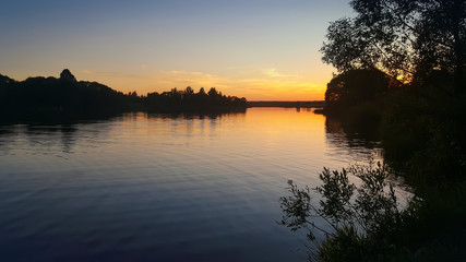 Obraz premium Beautiful sunset on the river 