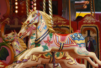 Fototapeta na wymiar Carousel horses at an authentic Victorian steam fair 