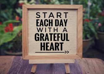 Motivational and inspirational quote - ‘Start each day with a grateful heart’ written on a...