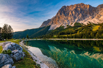 A beautiful view on the Ehrwalder Almsee and the Zugspitze on a sunny summer day in Austria, September 2018