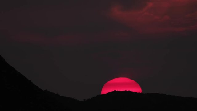 a firey vivid sunset in hte picos de europa, asturia, spain