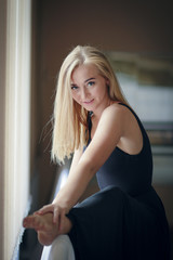 Fototapeta premium Young dancing girl in a choreographic classroom 