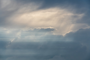 Fototapeta na wymiar Beautiful cloudscape with sun beams shining through