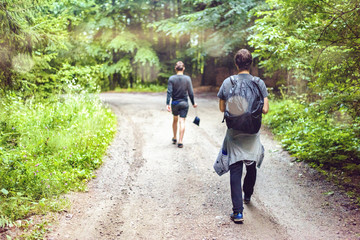 Fototapeta premium Man with backpack walking in Fagaras Mountains