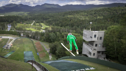 Ski jump athlete jumping at a summer practice at Lake Placid, NY