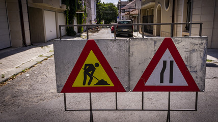 road signs indicating road repair. repair of urban road infrastructure.