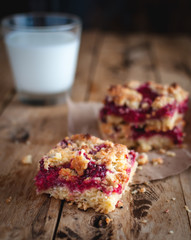 Close-up of raspberry crumb bar on wooden background