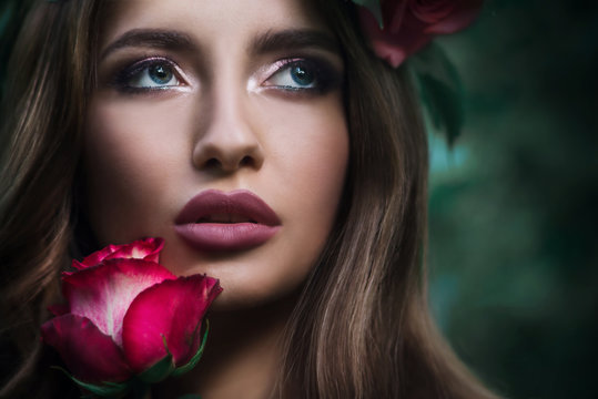 Beauty portrait of chubby lips sensual woman and roses.