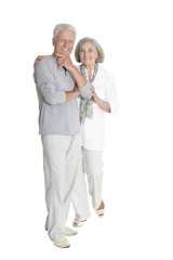 Portrait of senior couple hugging isolated on white background