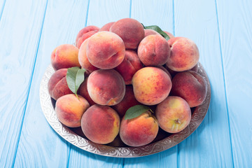 Ripe peaches fruit on rustic background