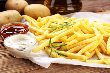 french fries potato with ketchup and mayonnaise.