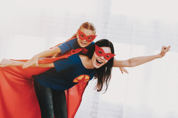 Mother And Daughter. Superhero Suits Concept.