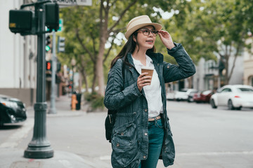 woman standing in the street happily