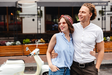 Smiling young couple standing together