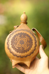 antique lether flask with pattern engraving and belt