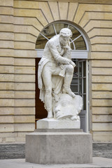 Fototapeta na wymiar Collège de France / Statue de Champollion / Rue des Ecoles / Paris V