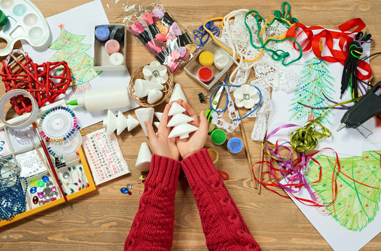 Childrens making decorations for new year holiday. Painting watercolors. Top view. Artwork workplace with creative accessories.