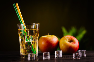 apple juice in glass on table. dark background concept