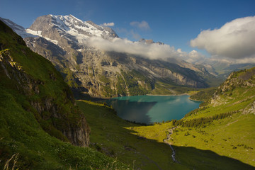 Mountains above the lake of Oeschinensee nearby resort of Kandersteg, Switzerland