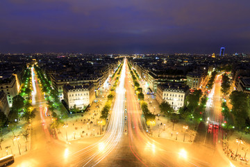 View of the Champs-Elysees seen from the Arc de Triomphe at twilight in Paris, France
