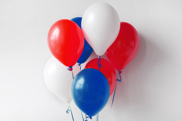 holidays and decorations concept - red, white and blue air balloons for 4th of july or birthday...