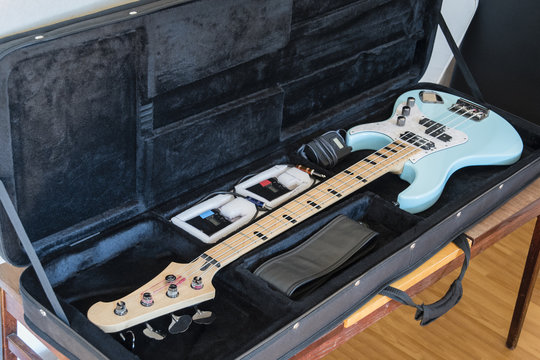 Bass guitar in case.