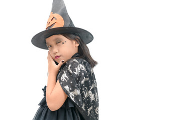 funny child girl in witch costume for Halloween