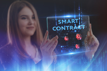 The concept of business, technology, the Internet and the network. A young entrepreneur working on a virtual screen of the future and sees the inscription: smart contract