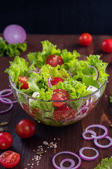 A glass salad bowl with a Greek salad