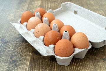 Raw chicken eggs in egg box