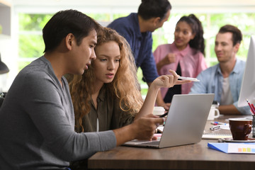 Fototapeta premium Group of businesspersons in creative business discussing work in the office