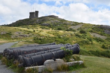 Cannons at Signal Hill, landmark tower in the background;  St John's NL Canada