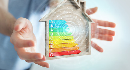 Businessman using 3D rendering energy rating chart in a wooden house