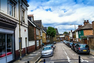 Old historic buildings in english style with small business or shops on Hoskins and Trenchard...