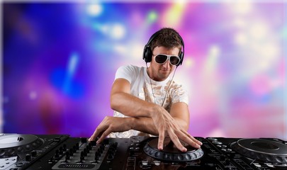 Portrait of confident young DJ with headphones