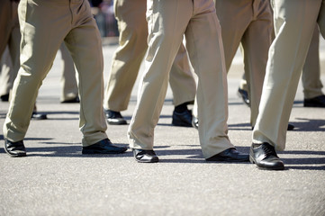 Fototapeta premium Military marching in a street. Legs and shoes in line