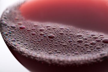 Close up of the wine bubbles. Bubbles on the surface of freshly poured wine