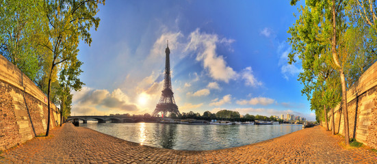 Naklejka premium Beautiful 180 degree HDR panorama at sunrise in spring of the Eiffel tower at the river Seine in Paris, France