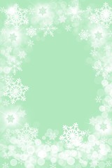 Fototapeta na wymiar green winter snowflake bokeh border holiday design background