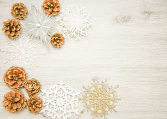 Christmas and New Year's composition. The pine cones, spruce. Branches on a wooden white background, top view