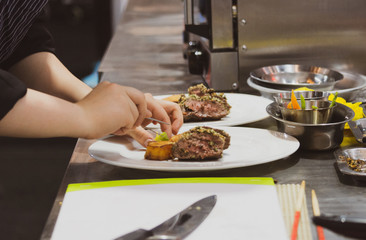 Chef preparing food, meal, in the kitchen, chef cooking, Chef decorating dish, closeup, chef at work
