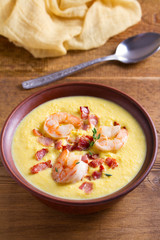 Creamy corn vegetable soup with shrimps and bacon
