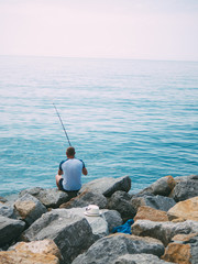 man fishing in the sea